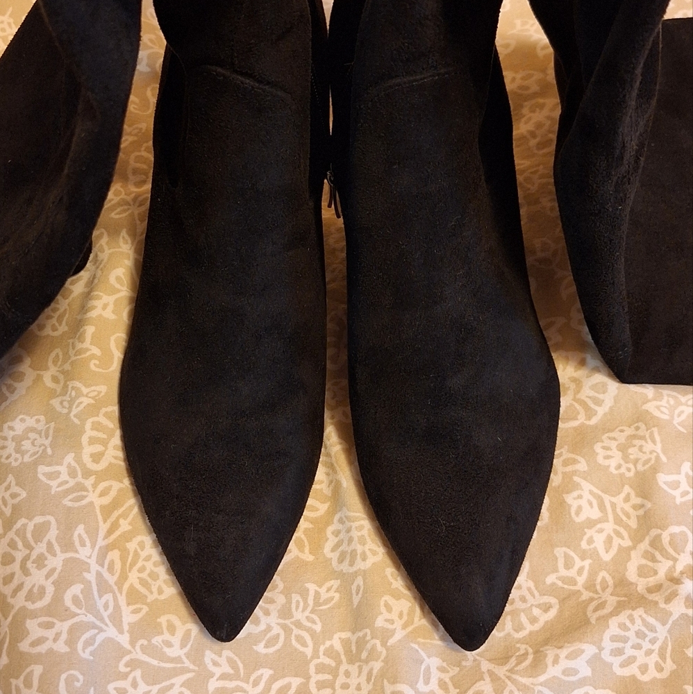 Thigh high pointy stilleto boots
